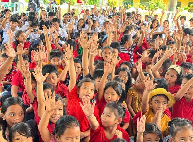Children raising their hands