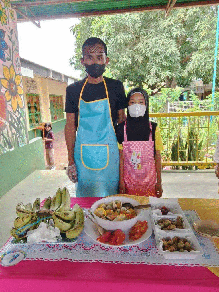 A father-daughter chef team win a cooking contest at Salih Yusah Elementary School in "Land of Bad" Philippines as a part of Nutrition Month in the Philippines, July 2025.