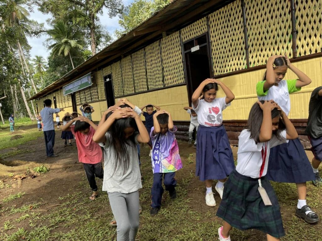 Earthquake protection drill at Lugmah Elementary School in a former war-torn community.