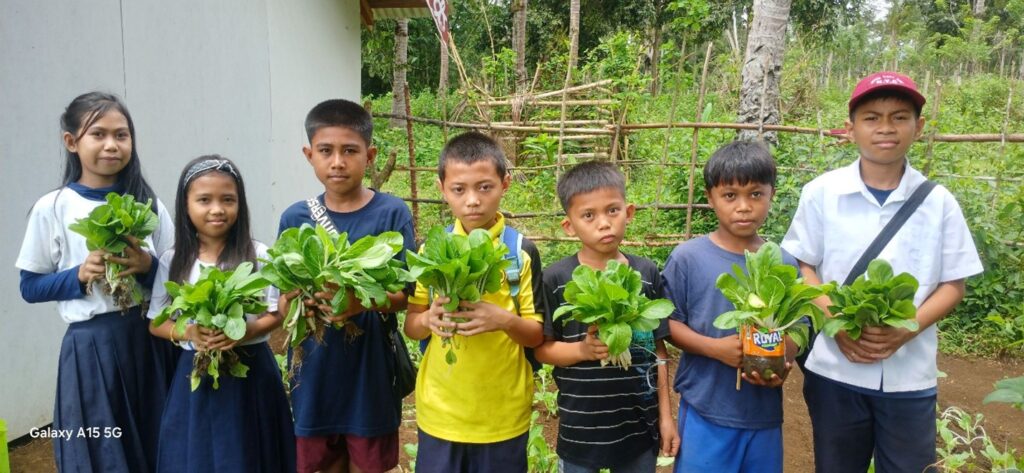 Students learn farming and nutritional skills via Lugmah ES school gardens.