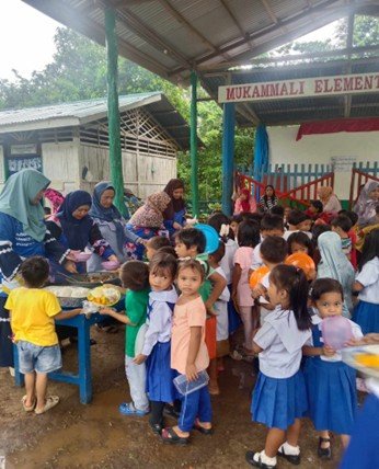 PTA Moms cook and serve free lunches for all children at Mukammali Elementary.