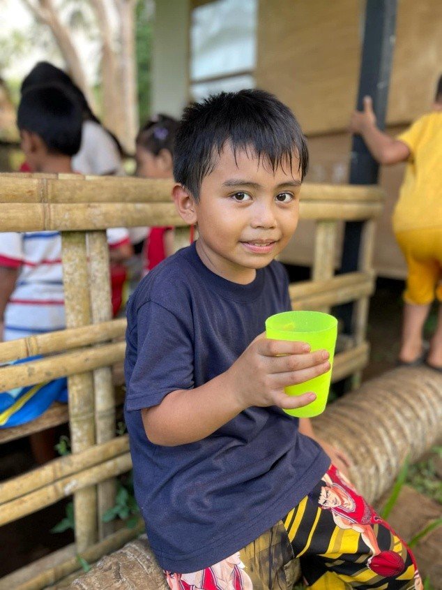 A child holding a cup